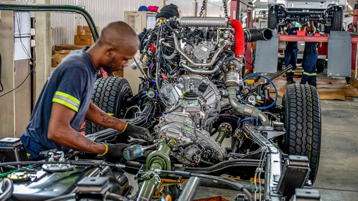 A team of colleagues celebrating success together in an office.